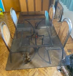 Glass dining table with old chairs 0