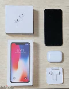 Black iPhone X with 256GB storage, EarPods , and AirPods