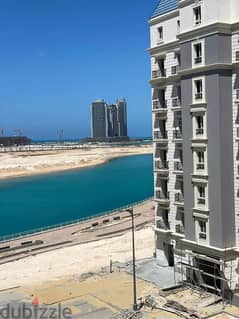 Ready to move in ((with a DP= of 750 k)) finished nautical apartment next to City Edge Towers in New Alamein in the Latin district, North coast 0