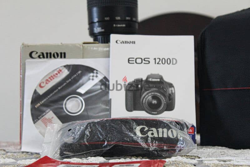 canon 1200D مع عدسه 70 300 جباره في العزل وبرده موجود العدسه الكت لينس 1