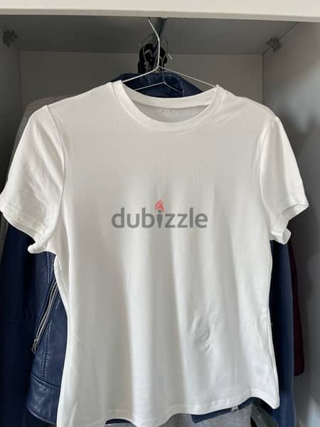 shein plain white top with a small iron burn size L 0