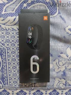 Mi Band 6 بحالة ممتازة 0