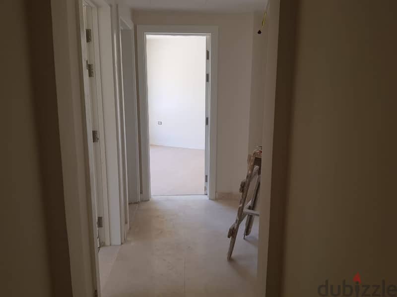 Apartment for sale at Owest شقة للبيع بكمبوند أويست استلام فوري متشطبة 10