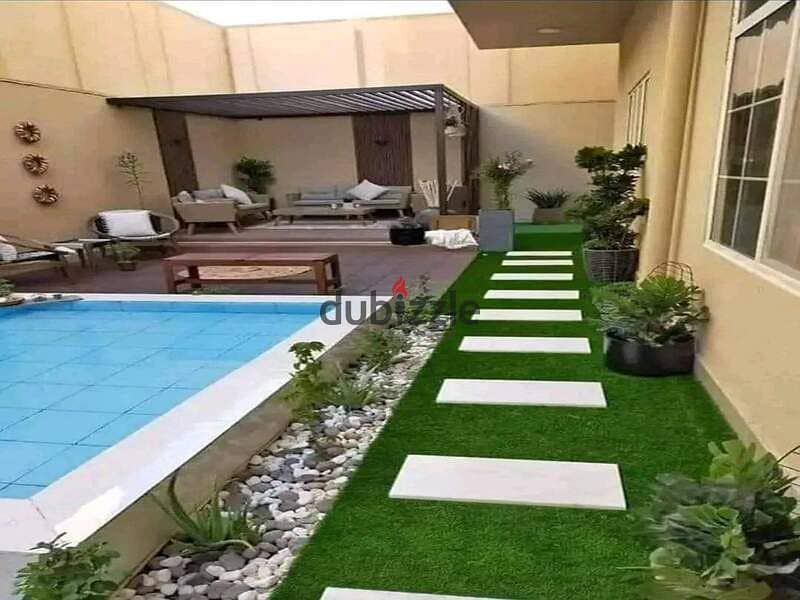 Villa for the price of an apartment in New Cairo, a full-service compound, directly on the Suez Road, next to with Madinaty 3