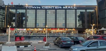 A shop for sale in Shorouk, with a finished facade, in the most famous commercial mall in front of the Green Hills Club and next to the Dar Misr gate,