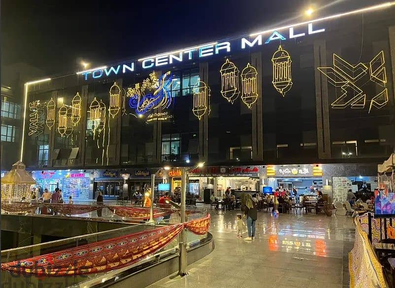 Shop for sale, ground floor, lower level, Town Center Mall, in the middle of the most famous brands with the highest traffic in Shorouk City, in insta 1