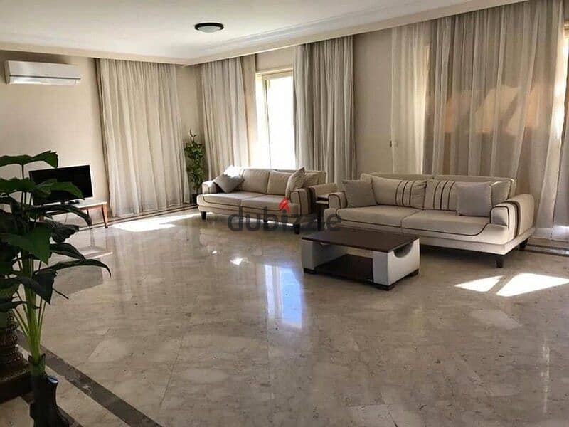 Ground floor apartment with garden, fully finished, directly on the lagoon, for sale in Palm Hills New Cairo Direct, directly on the ring road 1