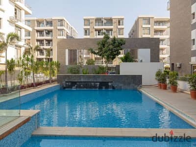 Ground floor duplex with garden for sale in Taj City Compound, First Settlement, in the most distinguished phases of the compound, with installments w