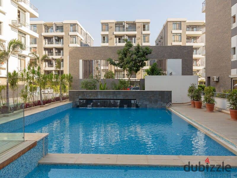 Ground floor duplex with garden for sale in Taj City Compound, First Settlement, in the most distinguished phases of the compound, with installments w 0