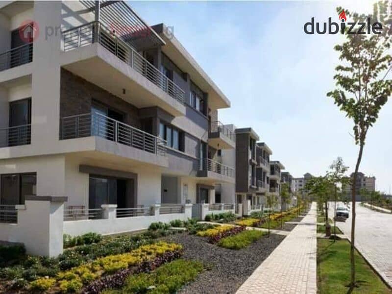 Ground floor duplex with garden for sale in Taj City Compound, First Settlement, in the most distinguished phases of the compound, with installments w 7