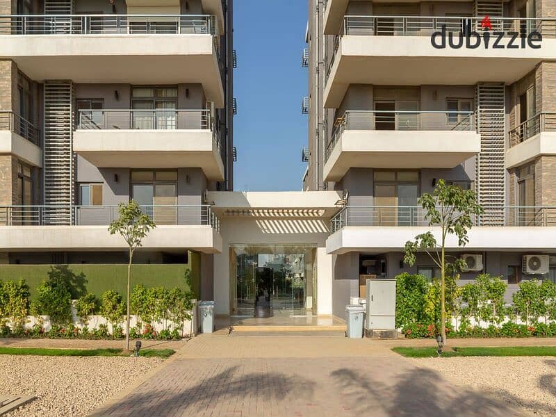 Ground floor duplex with garden for sale in Taj City Compound, First Settlement, in the most distinguished phases of the compound, with installments w 12