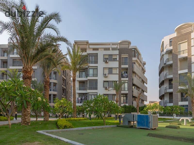 Ground floor duplex with garden for sale in Taj City Compound, First Settlement, in the most distinguished phases of the compound, with installments w 13