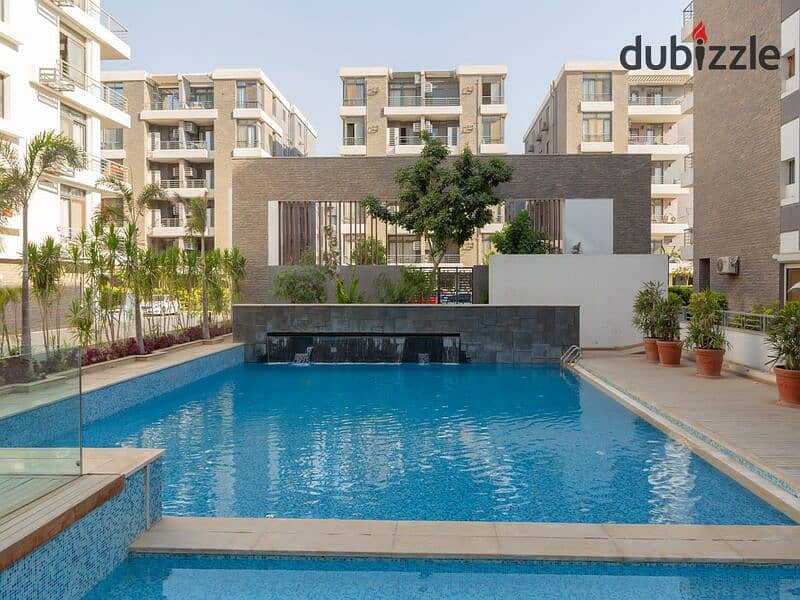 Garden duplex 220m for sale in Taj City Prime Location compound, with installments over 8 years, interest-free 15