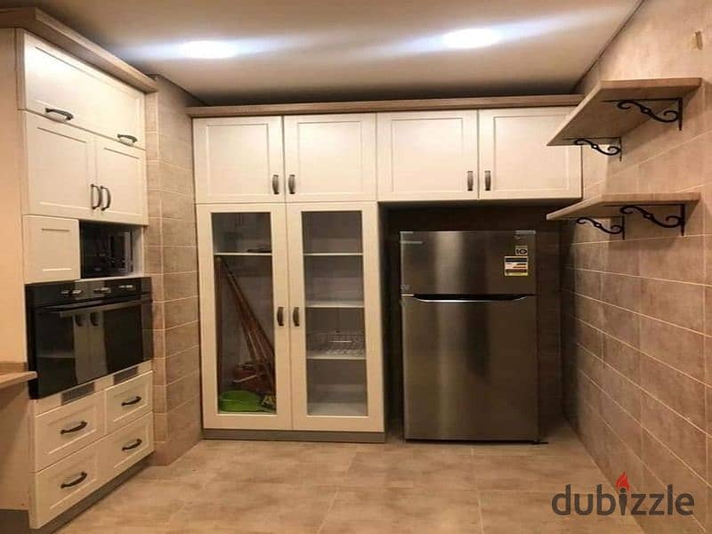 Ground floor duplex with garden for sale in Creek Town Compound, New Cairo 7