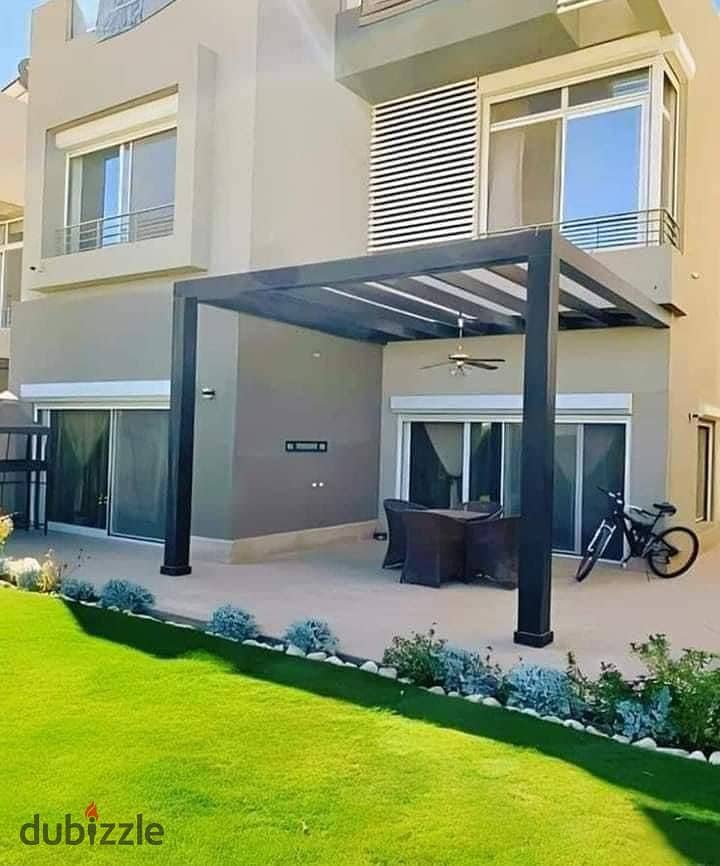 Immediately receive a standalone villa, prime location, for sale in Palm Hills New Cairo Compound, directly on the ring road, Palm Hills New Cairo. 1