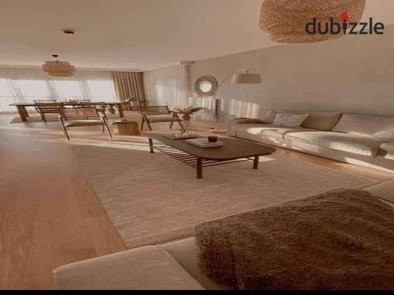 Garden duplex for sale in a compound with integrated services, directly on the Suez Road, in front of Al Rehab 1