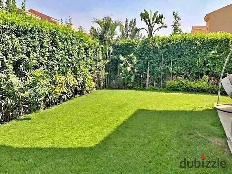 Garden duplex for sale in a compound with integrated services, directly on the Suez Road, in front of Al Rehab 9