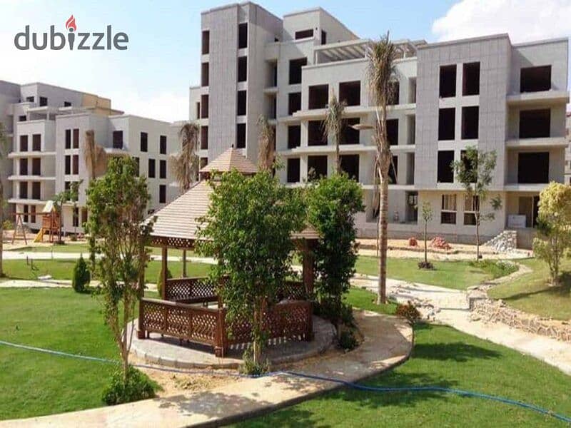 Garden duplex for sale in a compound with integrated services, directly on the Suez Road, in front of Al Rehab 12