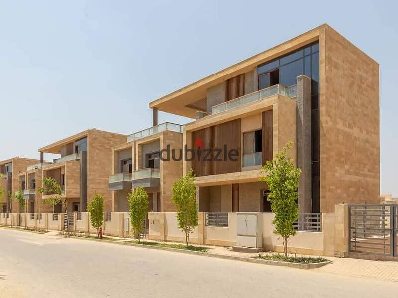 At the first offering price from Madinet Misr Company MNHD, own a prime location townhouse for sale in a fully serviced compound, wall by wall, with M 0