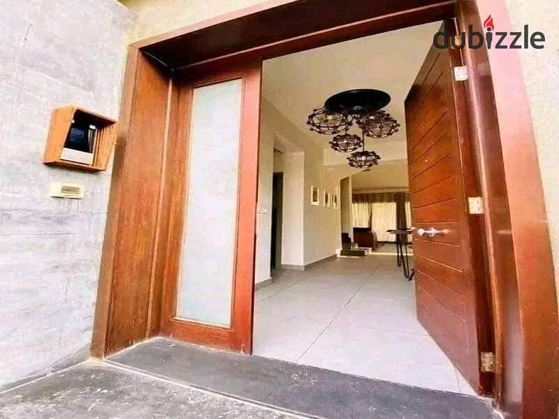 At the first offering price from Madinet Misr Company MNHD, own a prime location townhouse for sale in a fully serviced compound, wall by wall, with M 1