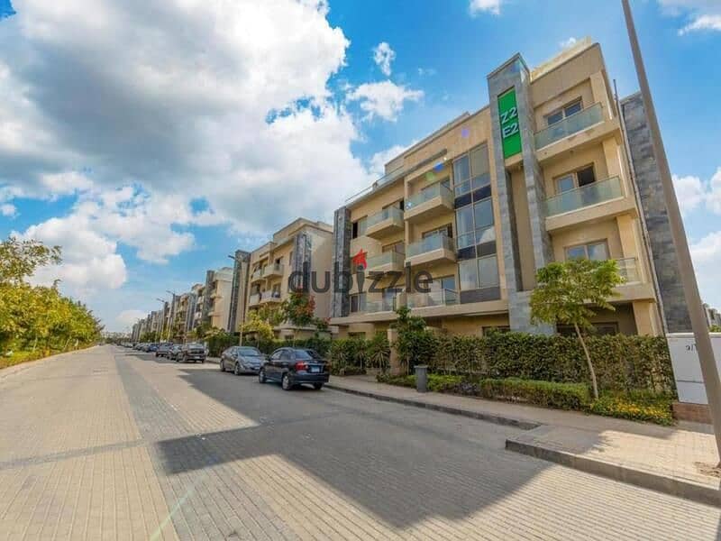 For sale, a two-bedroom apartment, immediate delivery, next to Palm Hills, in Gallaria Compound, New Cairo 1