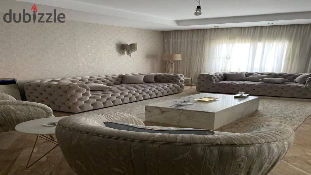 Fully finished ground floor apartment with garden for sale in Palm Hills New Cairo Direct, directly on the ring road 2