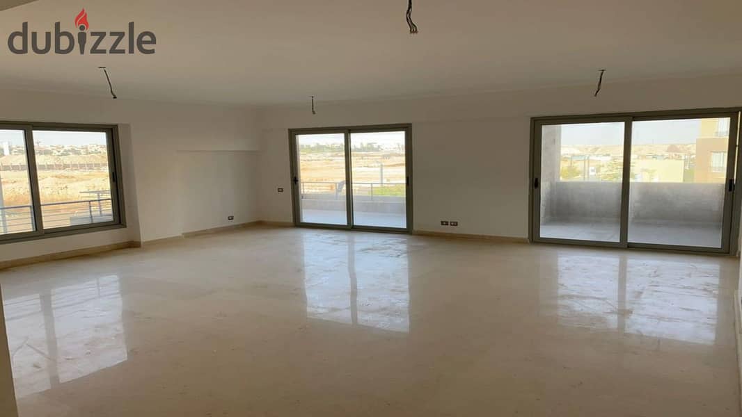 Fully finished ground floor apartment with garden for sale in Palm Hills New Cairo Direct, directly on the ring road 5