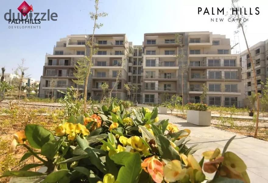 In Palm Hills New Cairo, a ground floor apartment with a garden, fully finished, Ultra Super Luxe, direct on the lagoon, for sale in Cleo Phase, Palm 9