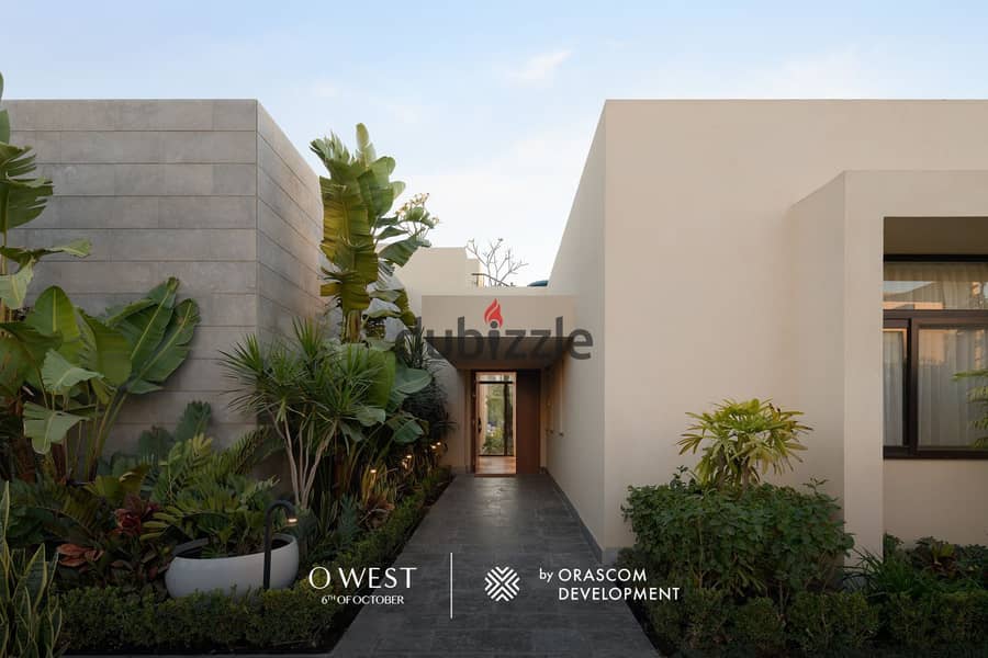 Own a villa in O West with a 400 sqm area and a 7-year installment plan, in a prime location directly on Wahat Road. 1