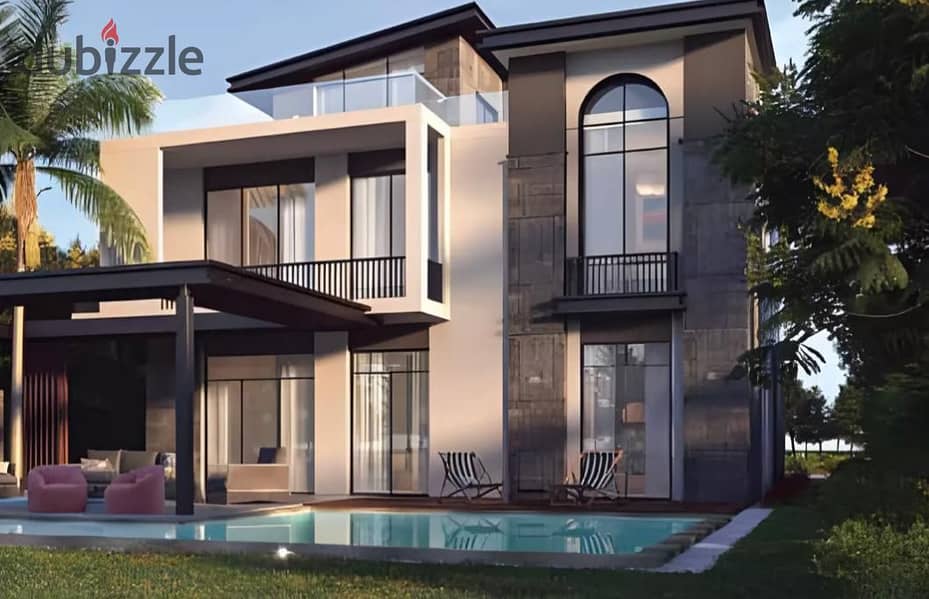 Live in a 3-storey villa with a landscape view, in installments over 9 years, in a prime location in Sheikh Zayed 5