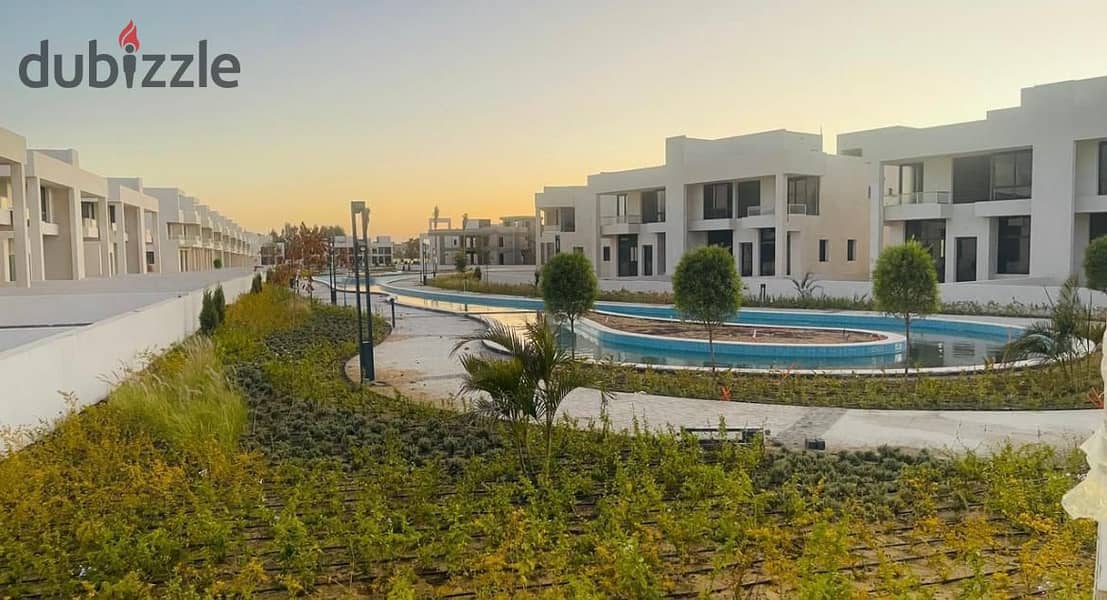 I live in a 3-storey villa with a landscape view, in installments, in a prime location, directly on Dahshur Street, in Lake West, Sheikh Zayed 0