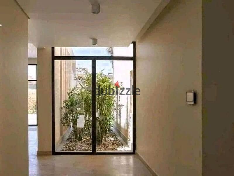 Apartment for sale in compound Taj city first settlement directly on suez road 1