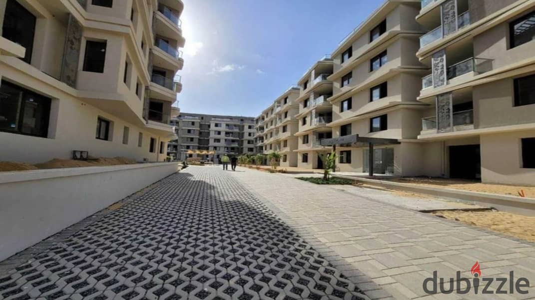 Finished apartment for immediate delivery in Badya Palm Hills Compound 11