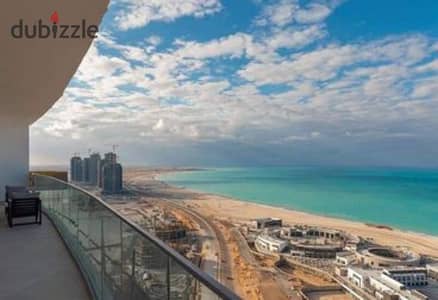 Hotel apartment with sea view (sea + lagoon) for sale in Al Alamein Towers, with installments over 12 years