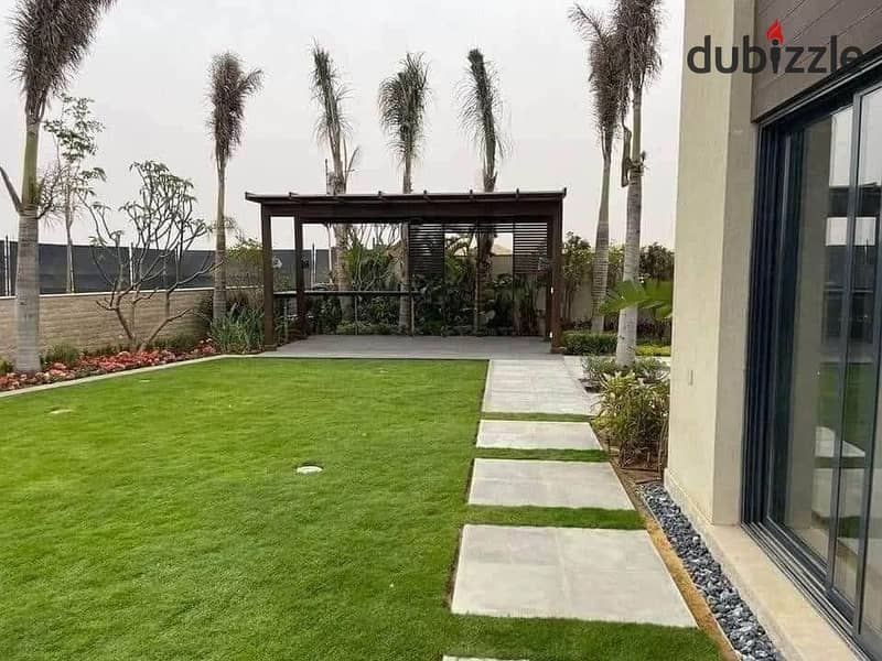 Villa for sale with a private garden, in installments, on a very special view, on the landscape, in front of Cairo Airport, in the Taj City compound. 1