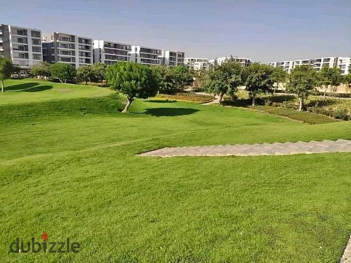 Apartment for sale in installments on a very special view on the landscape in front of Cairo International Airport in the Taj City compound 2