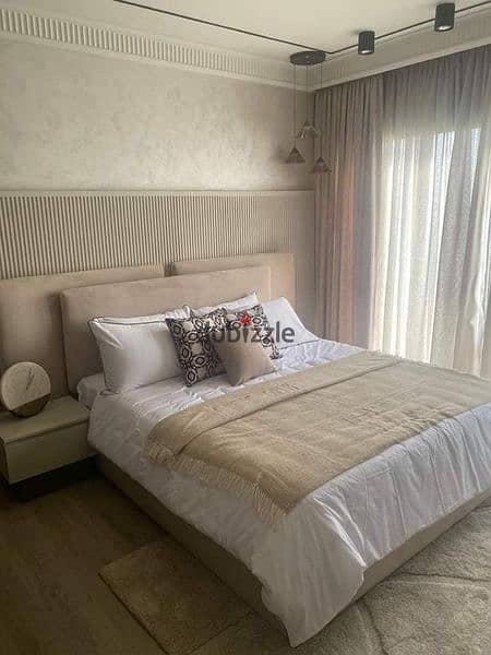 Apartment for sale in installments on a very special view on the landscape in front of Cairo International Airport in the Taj City compound 4