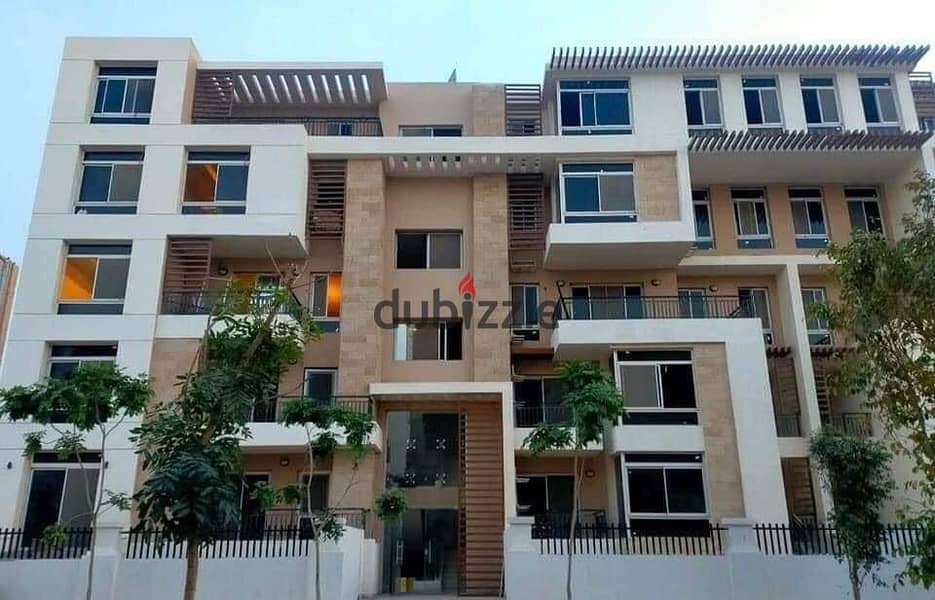 Apartment for sale in installments in a very special location on the Landscape in front of Cairo Airport in the Taj City Compound 7