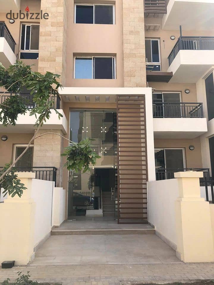 Apartment for sale in installments in a very special location on the Landscape in front of Cairo Airport in the Taj City Compound 8