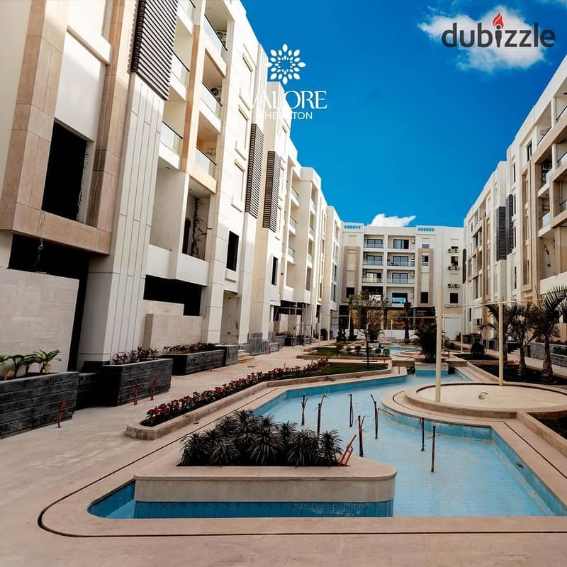 Apartment for sale in installments, fully finished, on a very special landscape, in the Sheraton (Al Jar) Compound 8