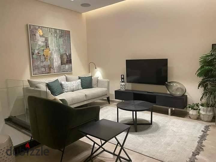 Apartment for sale in installments with cash discount on a very special view on Landscape in front of Cairo Airport in the Taj City Compound 3