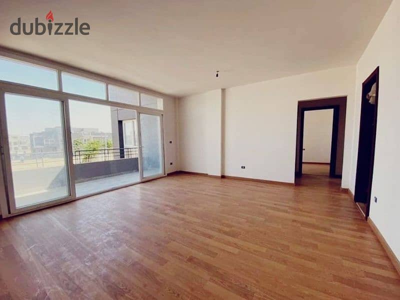 Distinctive 130-meter apartment for sale, fully finished, with a private garden in Sheikh Zayed 7