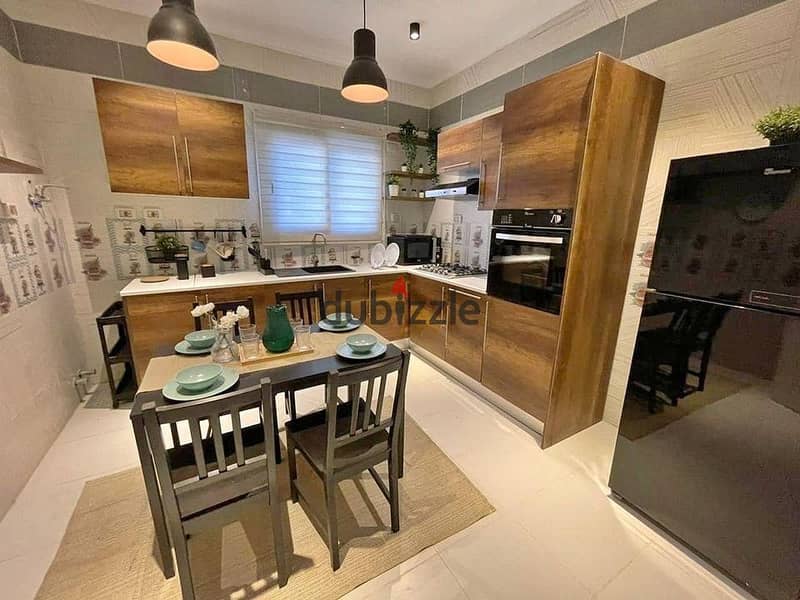 A ready-to-move-in apartment for sale in the heart of the New Administrative Capital, in Al-Maqsad Compound.  - Fully finished with a super lux 4