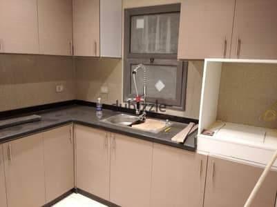 Apartment with kitchen & ACs for rent in Eastown sodic new Cairo fifth settlement