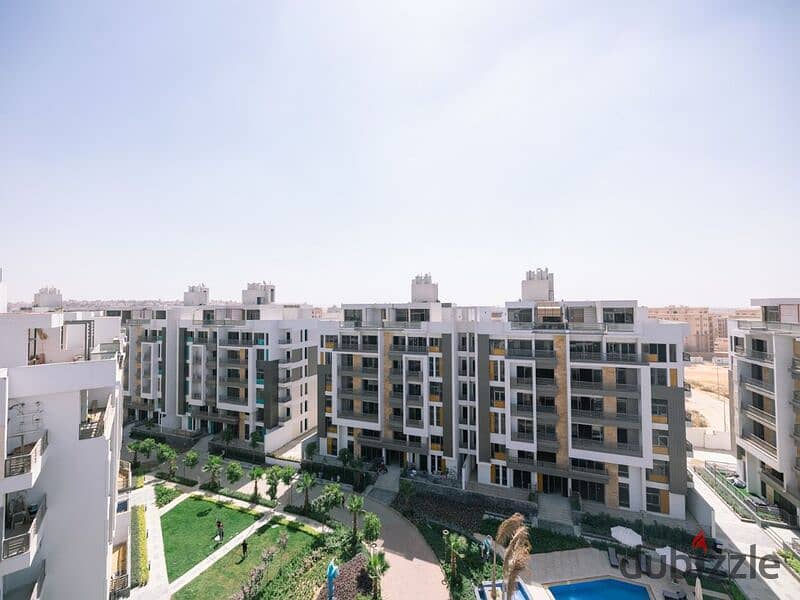 Apartment for sale in Fifth Settlement, Golden Square Icon Compound with only 15% down payment A distinctive view of the landscape 4