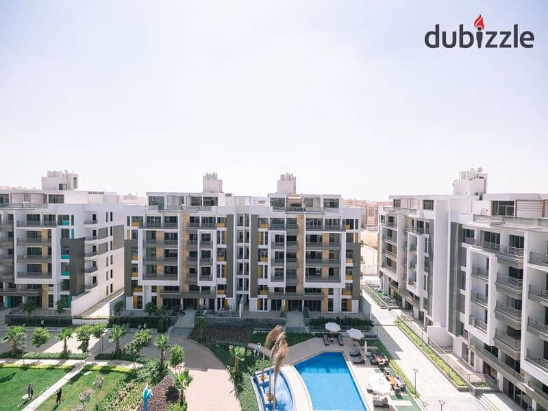 Apartment for sale in Fifth Settlement, Golden Square Icon Compound with only 15% down payment A distinctive view of the landscape 16