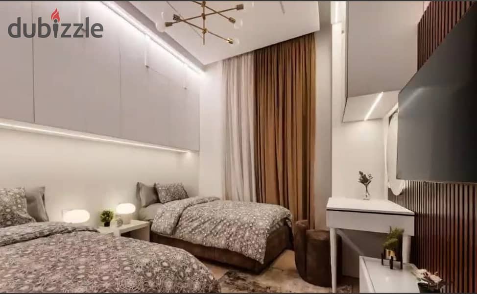 Furnished twin house for sale in Uptown Cairo, prime location 19