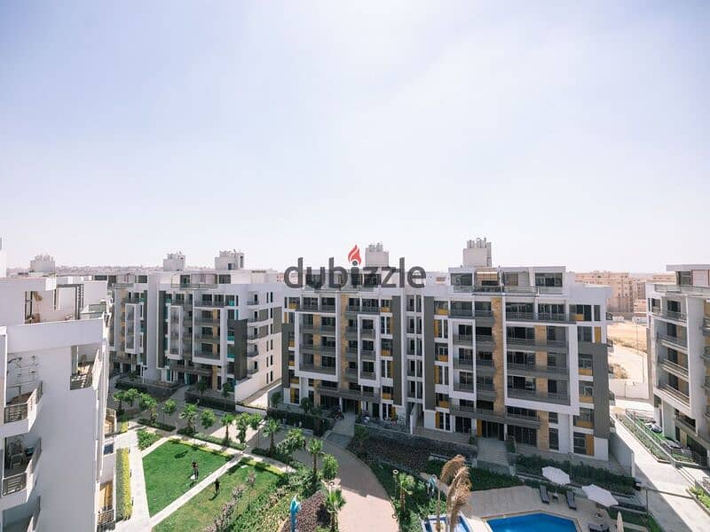 Two-bedroom apartment for sale in Golden Square in icon Compound with only 15% down payment | View on the landscape 17