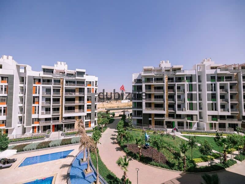 Two-bedroom apartment for sale in Golden Square in icon Compound with only 15% down payment | View on the landscape 20