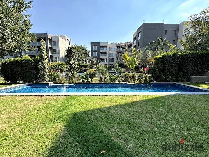 An apartment with a garden in a 1,000-acre compound with full services, in a special location in front of Cairo Airport, near Nasr City, Taj City. 4